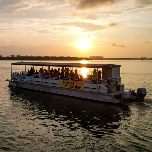 People on a sunset boat cruise