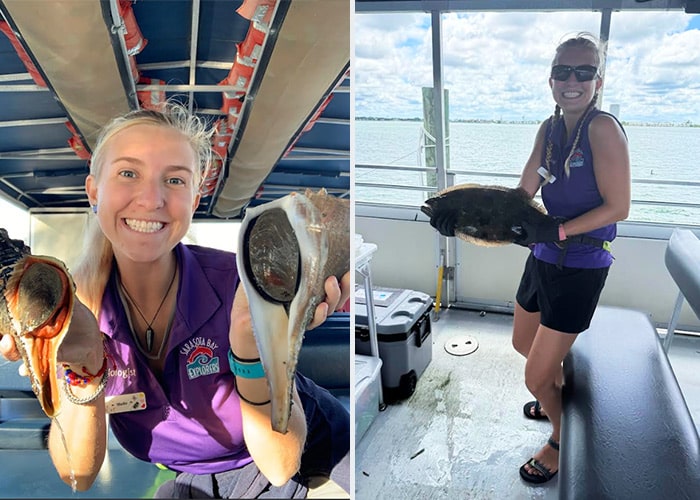 Marine Biologist Molly holding a fish on a boat in Sarasota Bay