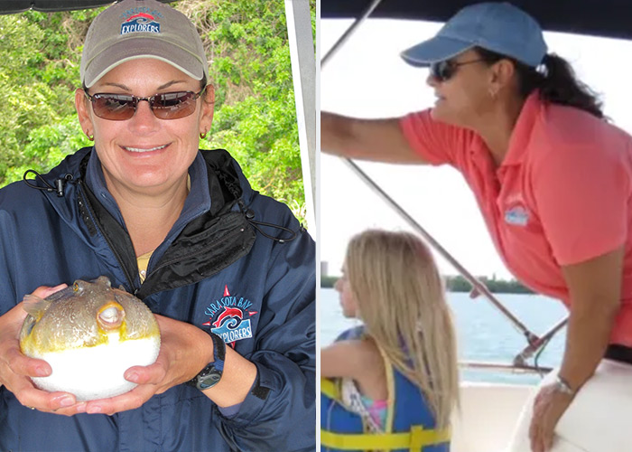 Meet-the-team-sondra Captain Sondra holding a pufferfish and pointing to a dolphin in Sarasota Bay